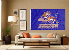Load image into Gallery viewer, indoor display of blue savannah state university flag for fan cave decor