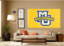Load image into Gallery viewer, indoor display of gold marquette university flag with mu marquette logo for man cave decor