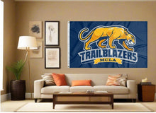 Load image into Gallery viewer, indoor display of Massachusetts College of Liberal Arts trailblazers flag for man cave decor