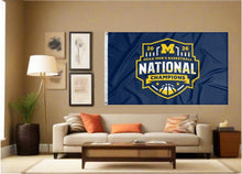 Load image into Gallery viewer, indoor display of Michigan 2026 March Madness Basketball Champions Flag as part of man cave decor