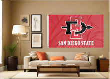 Load image into Gallery viewer, indoor display of red san diego state aztecs flag for fan cave decor