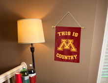 Load image into Gallery viewer, this is minnesota country garden flag hung inside a dorm for college dorm decor