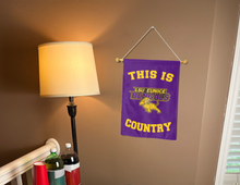Load image into Gallery viewer, this is lsu eunice bengals country garden flag hung inside a college dorm for dorm decor