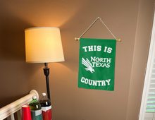 Load image into Gallery viewer, this is north texas country garden flag hung inside for college dorm decor