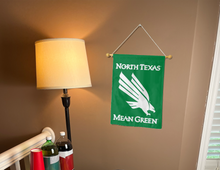 Load image into Gallery viewer, north texas mean green garden flag for college dorm decor hung inside a dorm