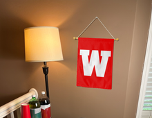Load image into Gallery viewer, red wku garden flag with w logo hung inside a room for college dorm decor