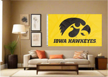 Load image into Gallery viewer, indoor display of gold university of iowa hawkeyes flag for man cave decor