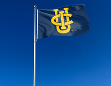 Load image into Gallery viewer, outdoor display of blue uc irvine flag for tailgate decor