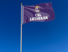 Load image into Gallery viewer, outdoor display of purple cal lutheran flag for tailgate decor