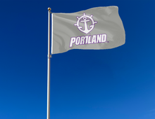 Load image into Gallery viewer, outdoor display of gray university of portland pilots flag for tailgate decor