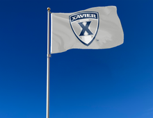 Load image into Gallery viewer, outdoor display of grey xavier university flag with shield logo for tailgate decor