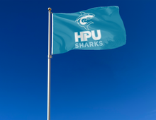 Load image into Gallery viewer, outdoor display of blue hpu sharks logo flag for tailgate decor