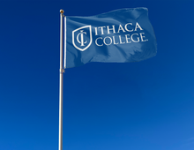 Load image into Gallery viewer, outdoor display of blue ithaca college 3x5 flag for tailgate decor