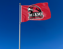 Load image into Gallery viewer, outdoor display of red miami university flag for tailgate decor