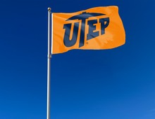Load image into Gallery viewer, outdoor display of orange utep miners flag for tailgate decor