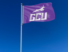 Load image into Gallery viewer, outdoor display of purple gcu flag for tailgate decor