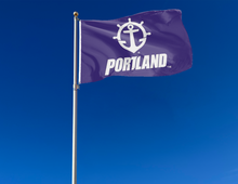 Load image into Gallery viewer, outdoor display of purple university of portland pilots flag for tailgate decor