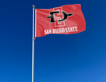 Load image into Gallery viewer, outdoor display of red san diego state aztecs flag for tailgate decor