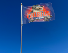 Load image into Gallery viewer, outdoor display of university of florida flag with realistic gator logo for tailgate decor