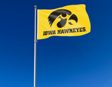 Load image into Gallery viewer, outdoor display of gold university of iowa hawkeyes flag for tailgate decor