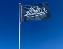 Load image into Gallery viewer, outdoor display of blue university of maine flag with maine logo for tailgate decor