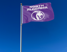 Load image into Gallery viewer, outdoor display of purple university of north alabama flag for tailgate decor