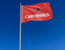 Load image into Gallery viewer, outdoor display of red university of the incarnate word cardinals flag for tailgate decor