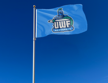 Load image into Gallery viewer, outdoor display of blue university of west florida argonauts flag for tailgate decor