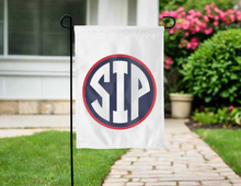 Load image into Gallery viewer, white double sided garden flag with ole miss sip logo hung outside for yard decor