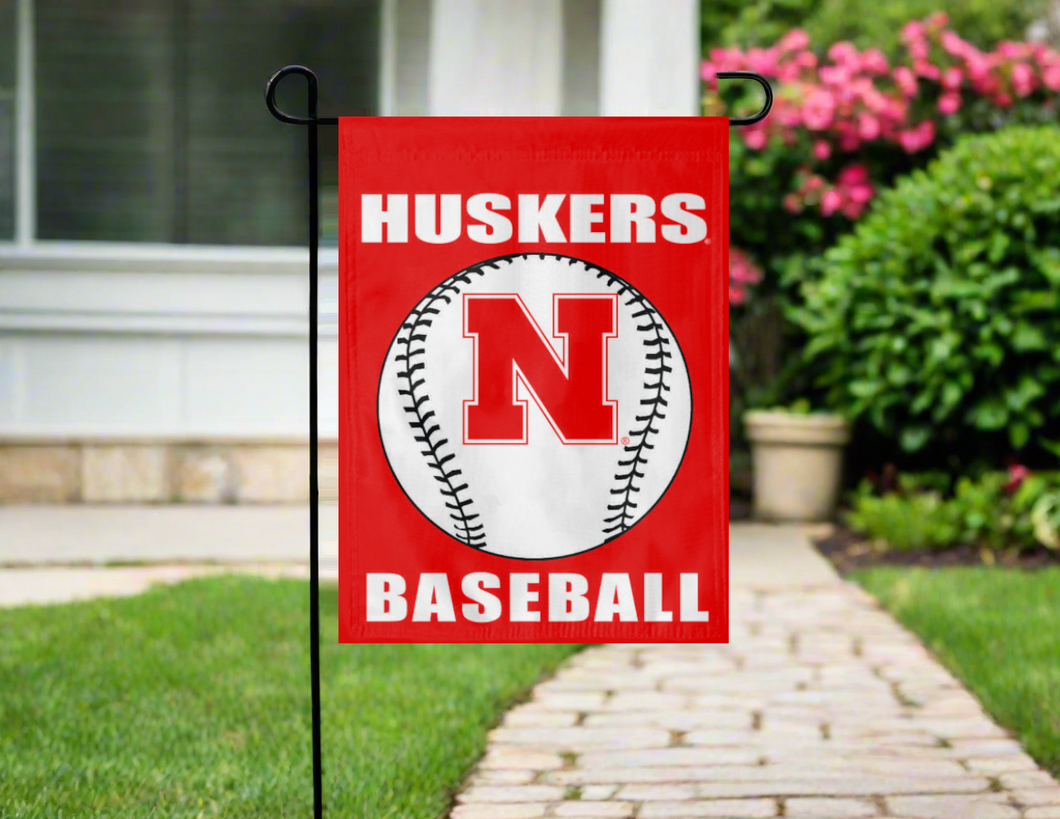 red nebraska baseball garden flag hung outside from a garden flag stand