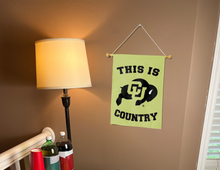 Load image into Gallery viewer, gold University of Colorado This Is Boulder Buffaloes Country Garden Flag hung from banner pole
