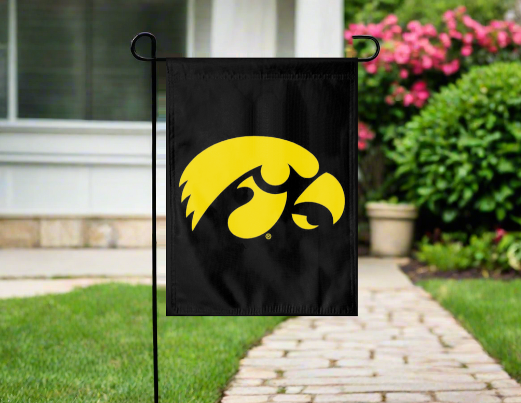 black university of Iowa garden flag hung outside from garden flag stand