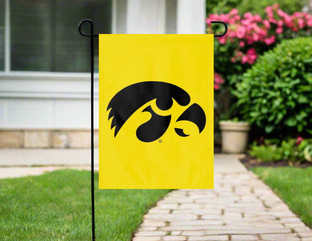 gold university of Iowa garden flag hung outside from garden flag stand