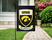 Load image into Gallery viewer, iowa hawkeyes garden flag with shield logo and go hawkeyes outside on garden flag stand
