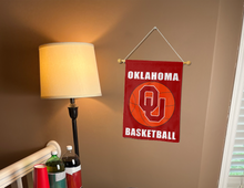 Load image into Gallery viewer, red oklahoma basketball garden flag hung on banner pole next to lamp and drinks
