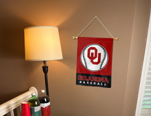 Load image into Gallery viewer, red and black oklahoma softball garden flag hung on banner pole next to lamp and drinks
