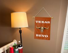 Load image into Gallery viewer, university of texas garden flag with bevo mascot logo hanging on banner pole next to a lamp and drinks
