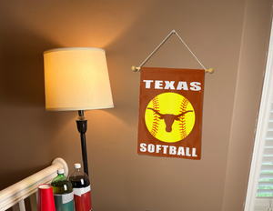 texas softball garden flag hanging on banner pole next to a lamp and drinks