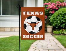 Load image into Gallery viewer, texas soccer garden flag hanging on garden flag stand outside
