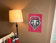 Load image into Gallery viewer, red university of new mexico lobos garden flag hanging on banner pole inside living room
