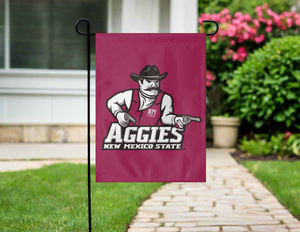 maroon new mexico state university garden flag hung outside from garden flag stand