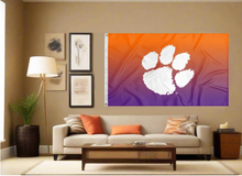 Load image into Gallery viewer, Gradient 3x5 feet wide Clemson University Flag with two metal grommets for indoor home décor covering tan wall of well lit room
