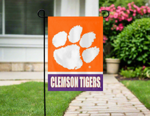 Load image into Gallery viewer, orange and purple clemson tigers garden flag hung outside from garden flag stand
