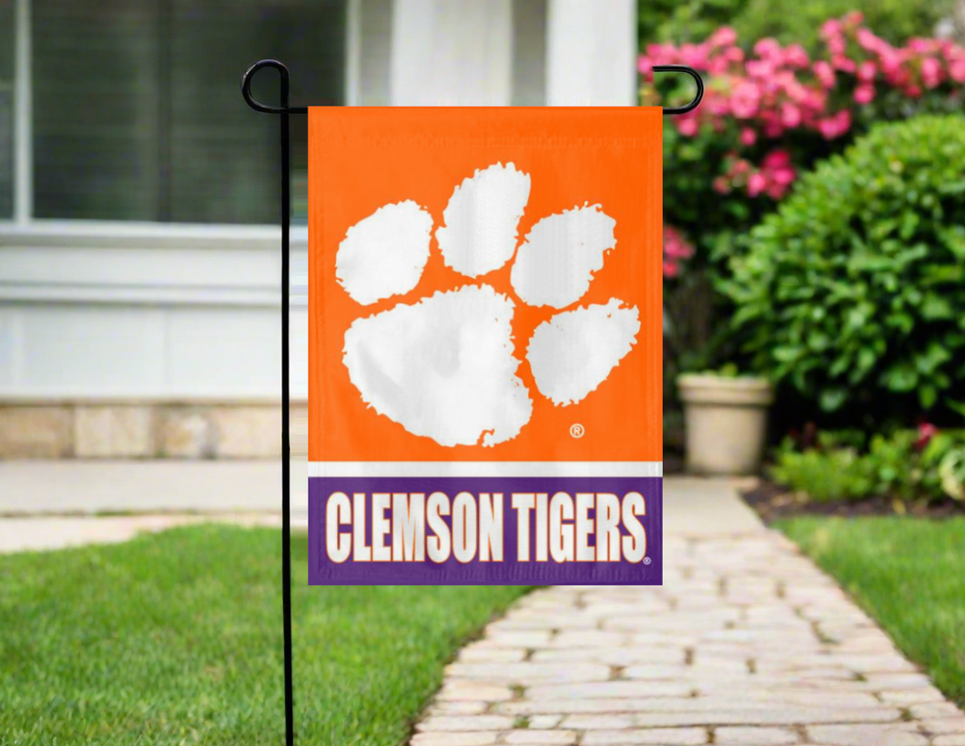 orange and purple clemson tigers garden flag hung outside from garden flag stand