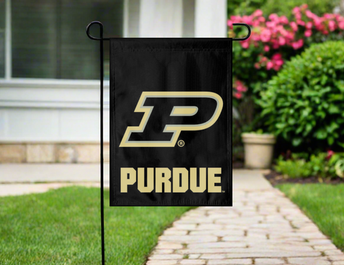 purdue university garden flag hanging on a garden flag stand