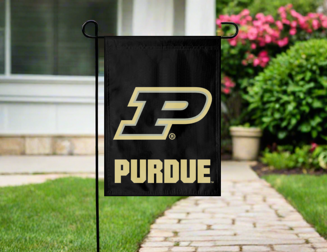 purdue university garden flag hanging on a garden flag stand