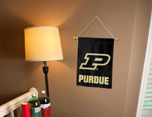 Load image into Gallery viewer, purdue university garden flag hanging on banner pole next to a lamp and drinks
