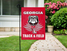Load image into Gallery viewer, red georgia track and field garden flag hanging on garden flag stand outside
