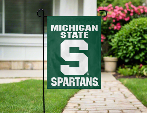 green msu garden flag hung outside from garden flag stand