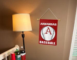 red arkansas baseball garden flag hanging on banner pole inside living room